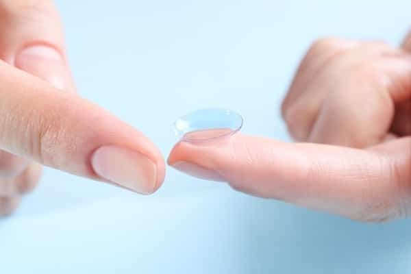 contact lense at a fingertip