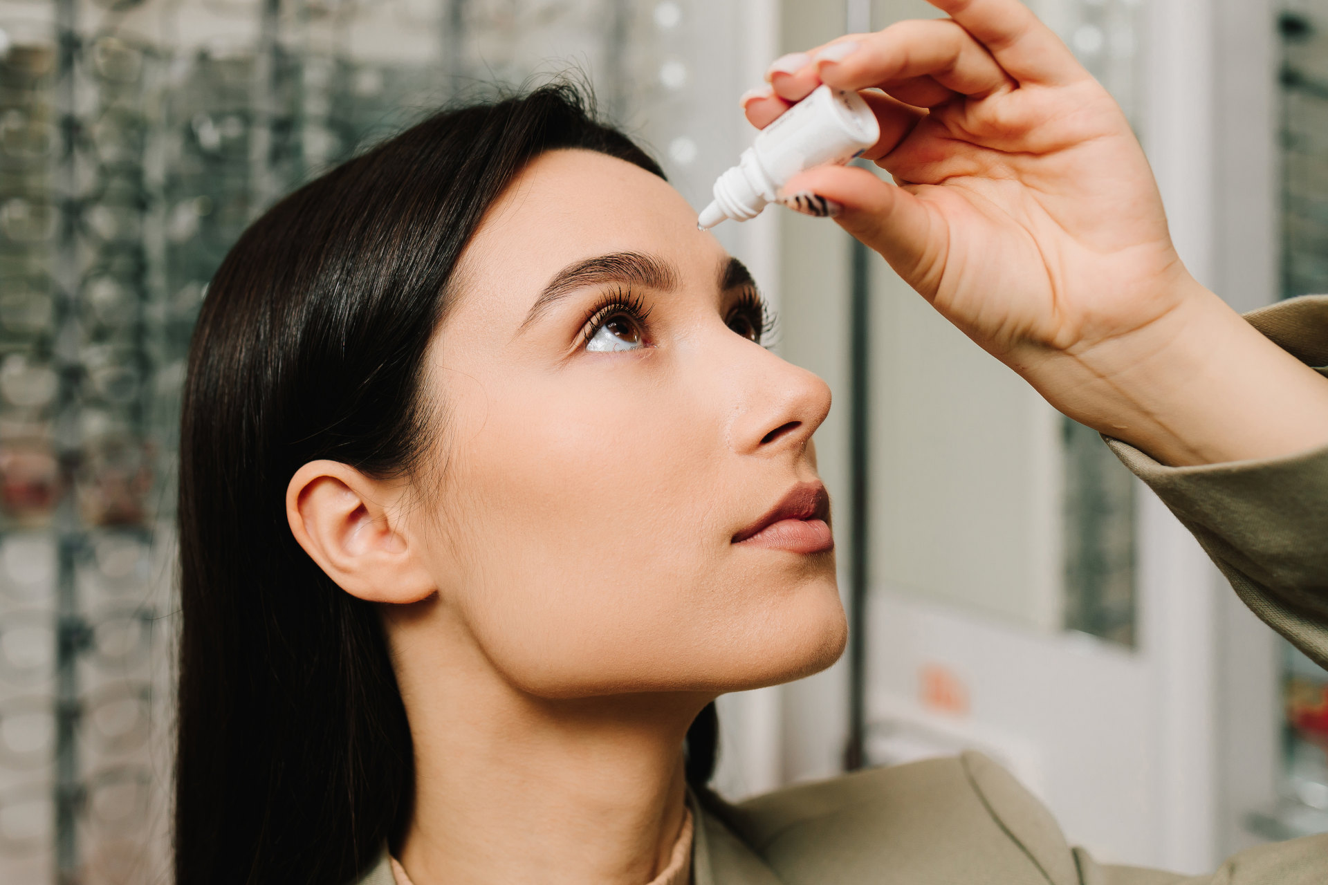Corporate worker putting eye drops