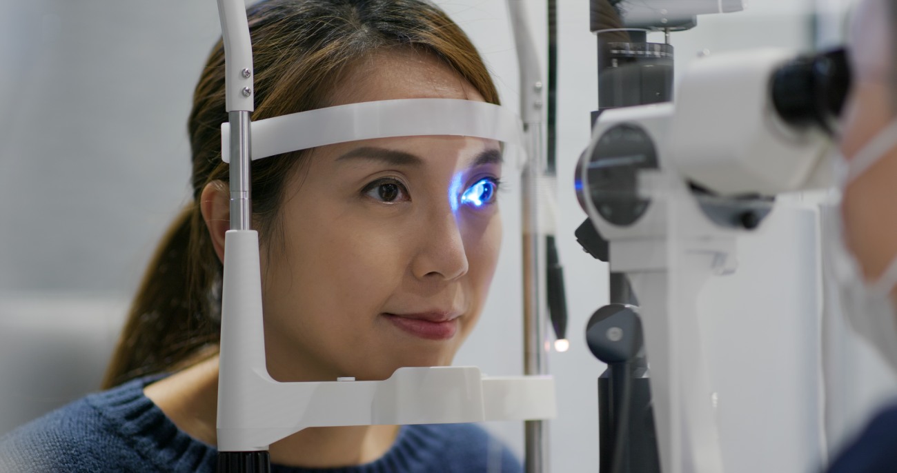 Lady at eye clinic receiving Professional eye assessment by doctor